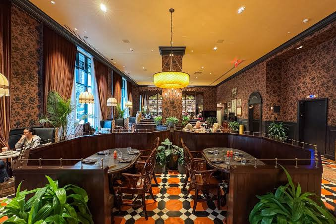 Graduate Princeton’s warm wood dining room with patterned floors